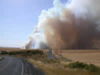 4:20pm Fire crossing NE over Oehlschlaeger Road.